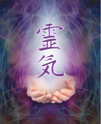 Japanese characters above illuminated hands.  This photo represents Reiki spiritual healing.